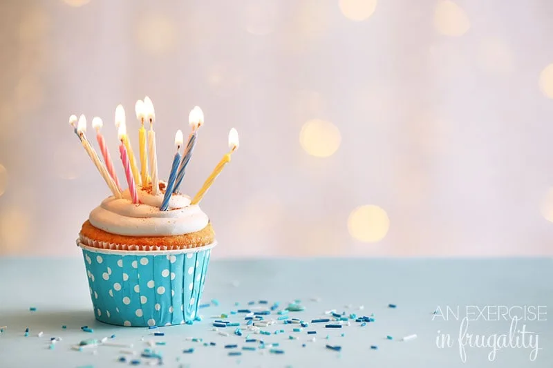 birthday cupcake with candles and sprinkles