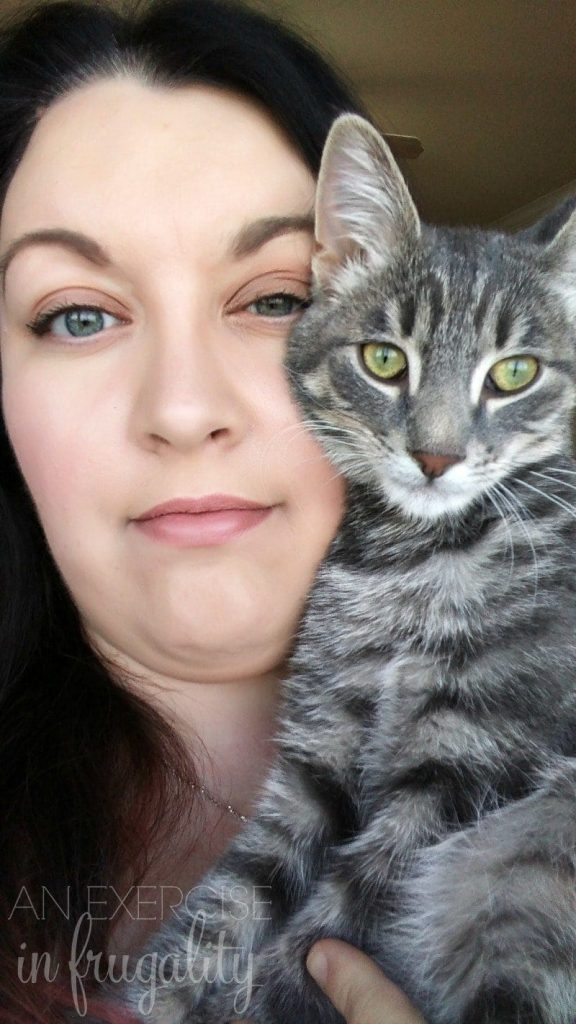 woman and kitten posing for a picture