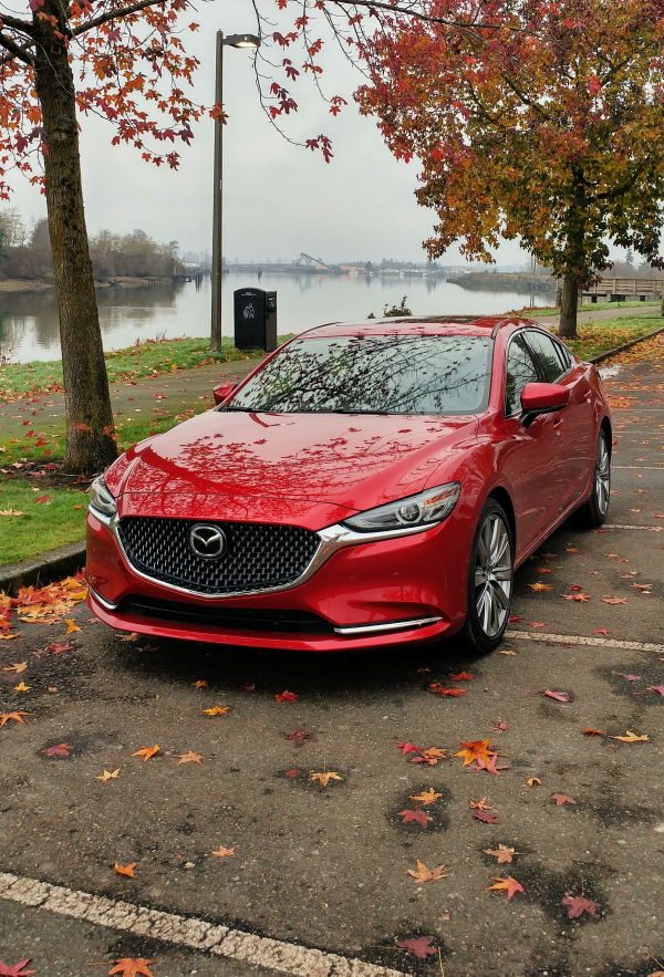 red 2019 mazda 6 parked in leaves