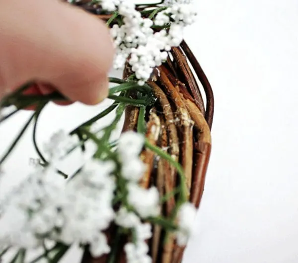 attaching baby's breath to wreath