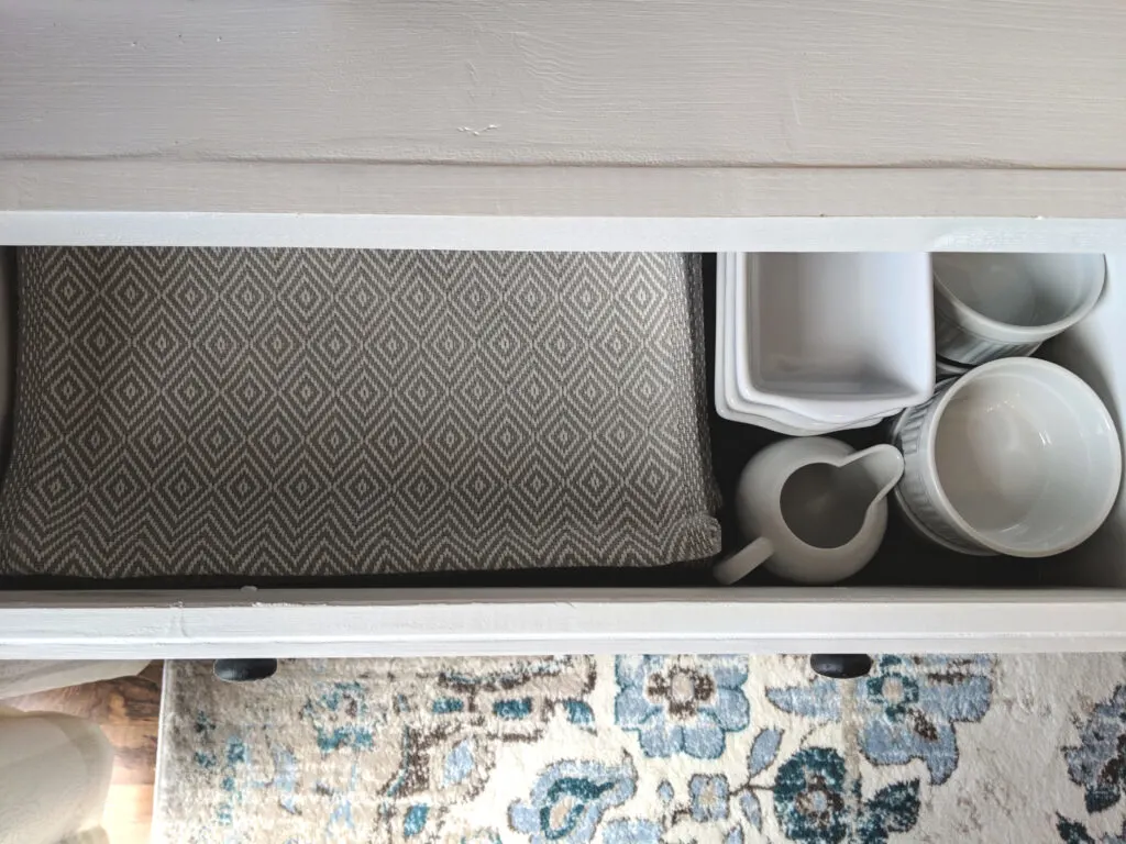 serving ware stored in buffet cabinet