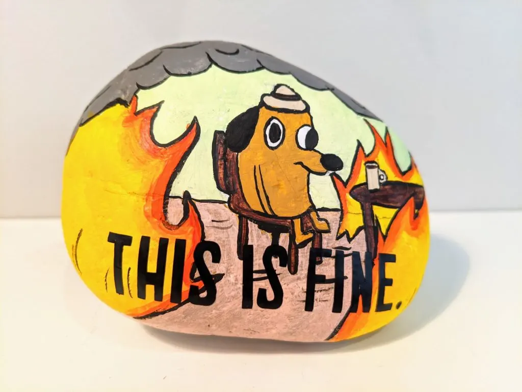 rock painted with this is fine message and a room on fire